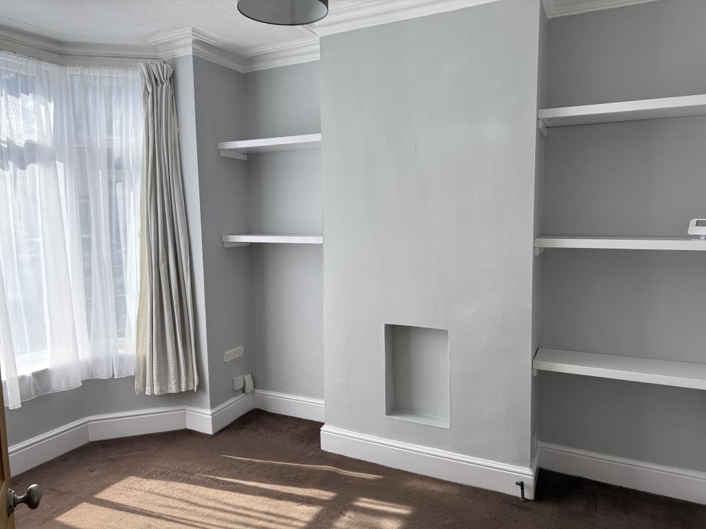 Lot: 123 - TERRACED HOUSE READY FOR OCCUPATION OR INVESTMENT - Living room with painted walls and bay window